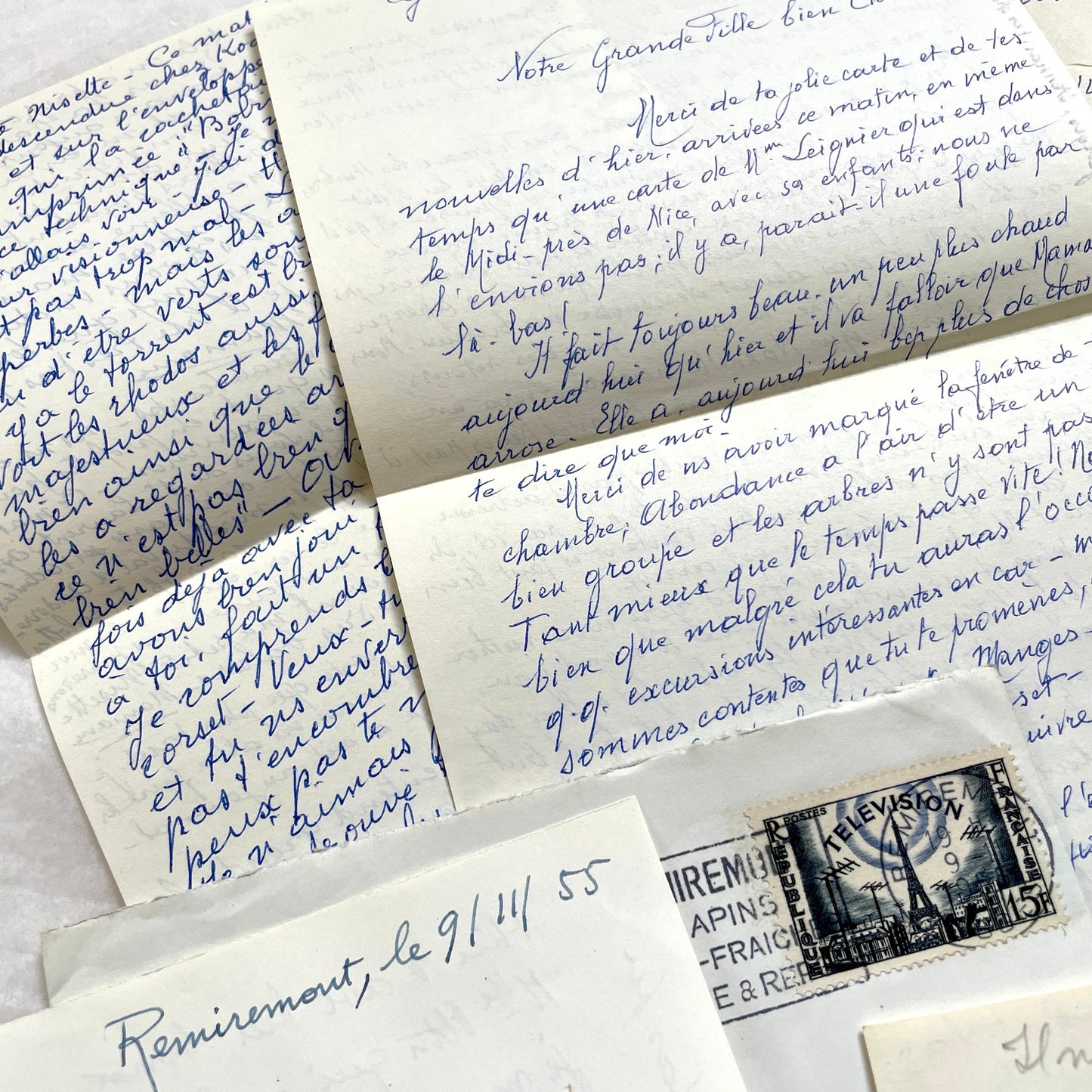 Set of 1950s French handwritten letters and envelopes with stamps. Vintage paper ephemera for collectors.