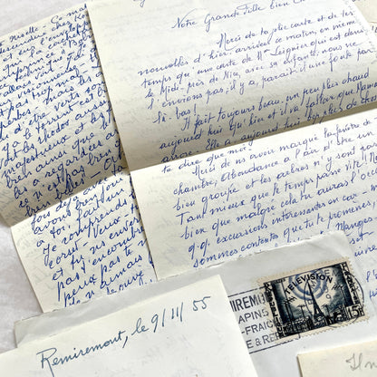 Set of 1950s French handwritten letters and envelopes with stamps. Vintage paper ephemera for collectors.