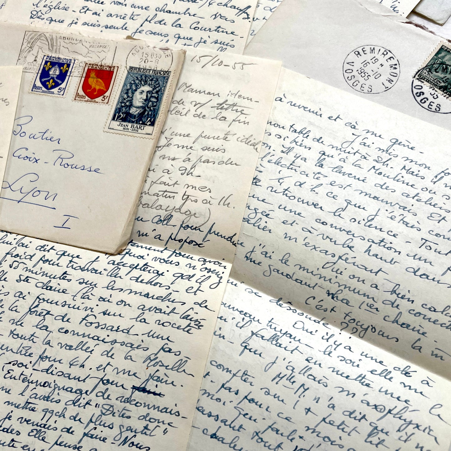 Set of 1950s French handwritten letters and envelopes with stamps. Vintage paper ephemera for collectors.