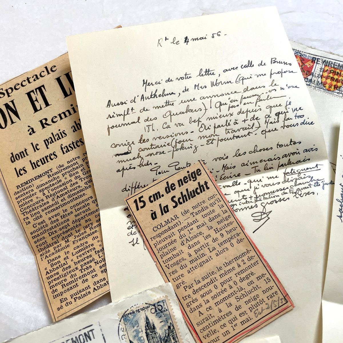1950s French handwritten letters set with envelopes, vintage stamps, and cursive script ephemera.