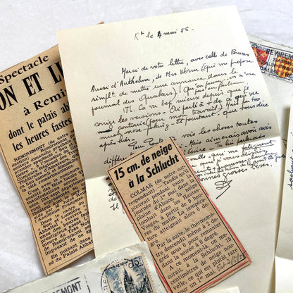 1950s French handwritten letters set with envelopes, vintage stamps, and cursive script ephemera.