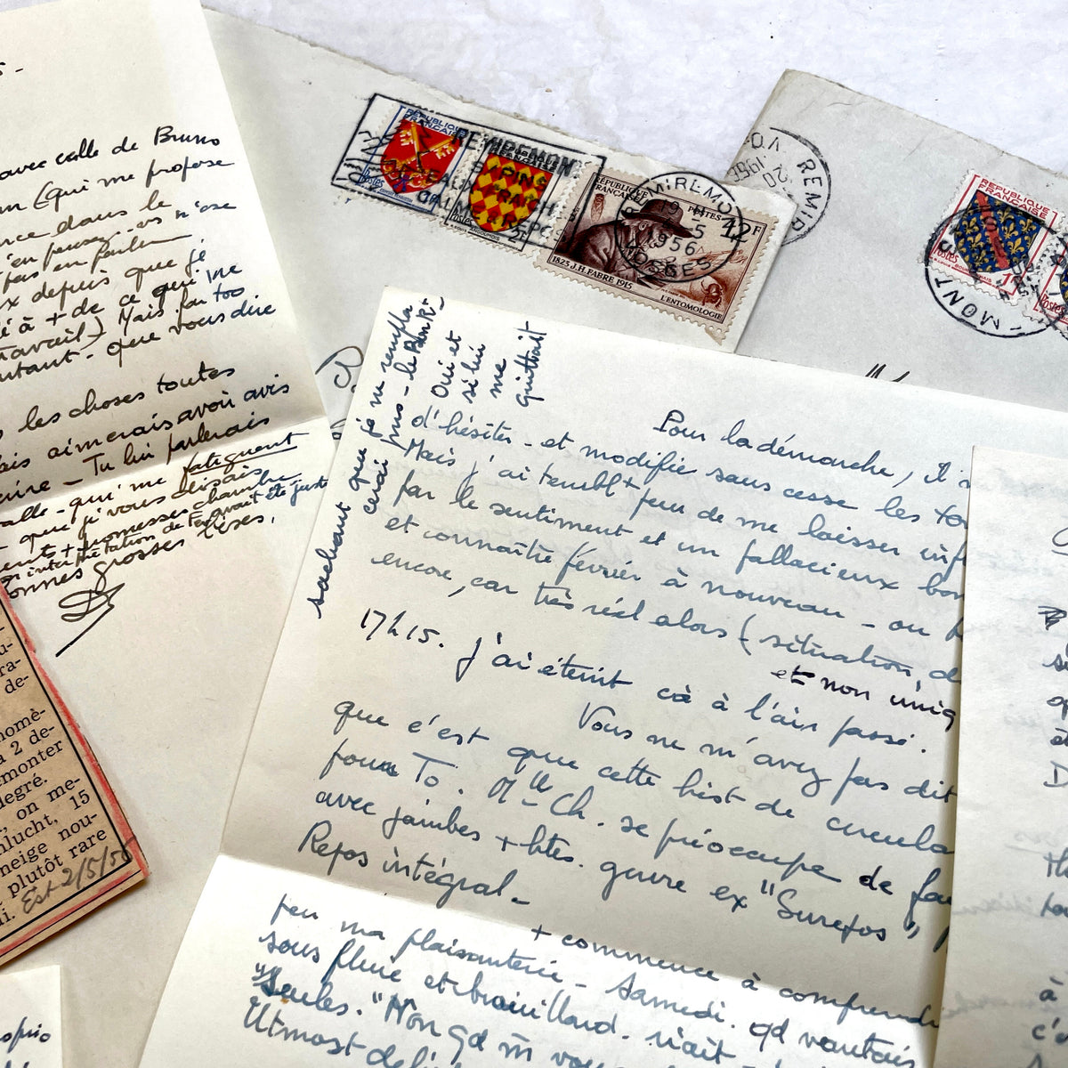 1950s French handwritten letters set with envelopes, vintage stamps, and cursive script ephemera.