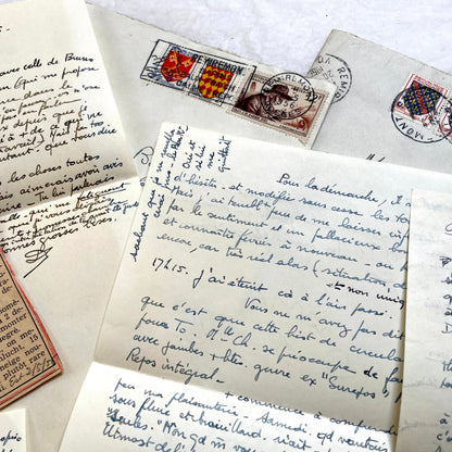 1950s French handwritten letters set with envelopes, vintage stamps, and cursive script ephemera.