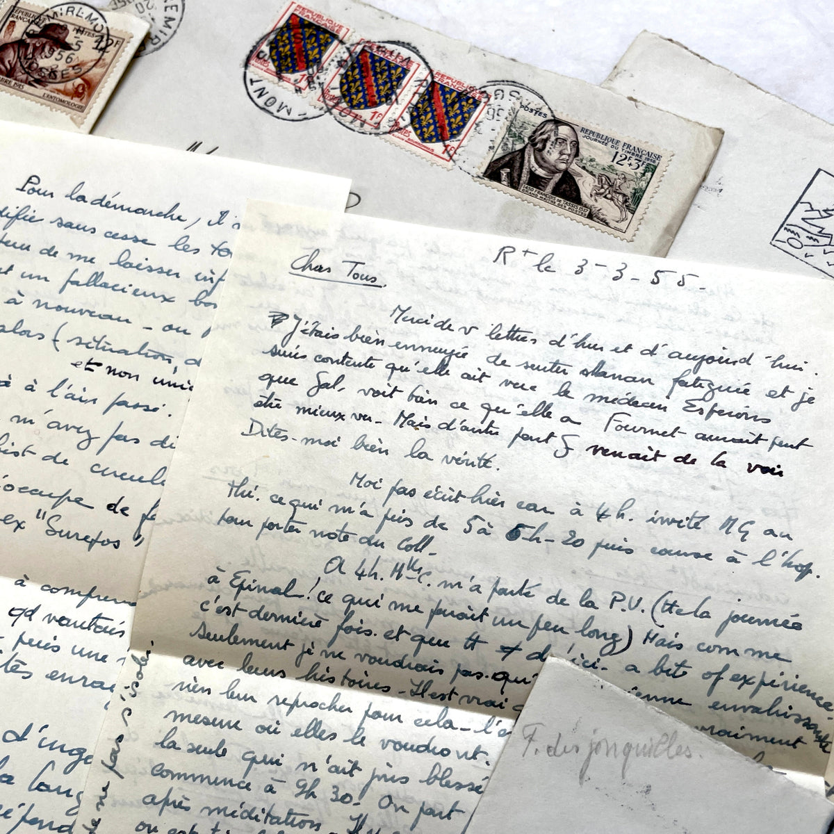 1950s French handwritten letters set with envelopes, vintage stamps, and cursive script ephemera.