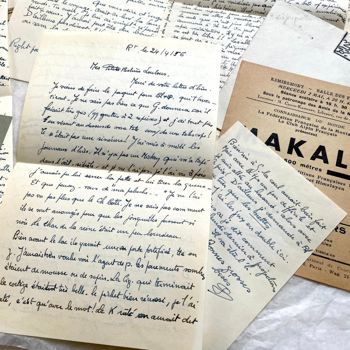 1950s French handwritten letters set with envelopes, vintage stamps, and cursive script ephemera.