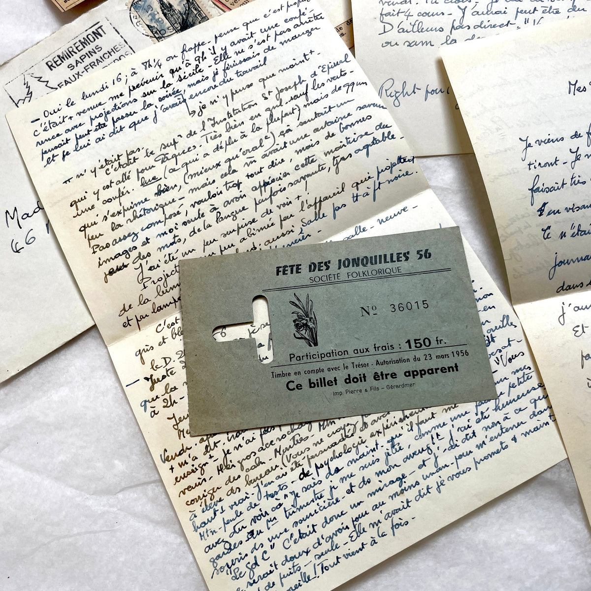1950s French handwritten letters set with envelopes, vintage stamps, and cursive script ephemera.