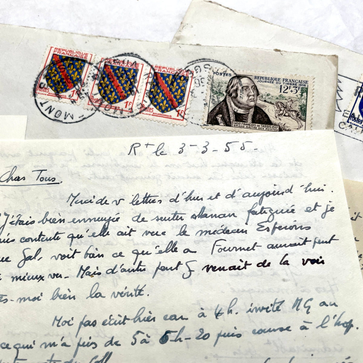 1950s French handwritten letters set with envelopes, vintage stamps, and cursive script ephemera.