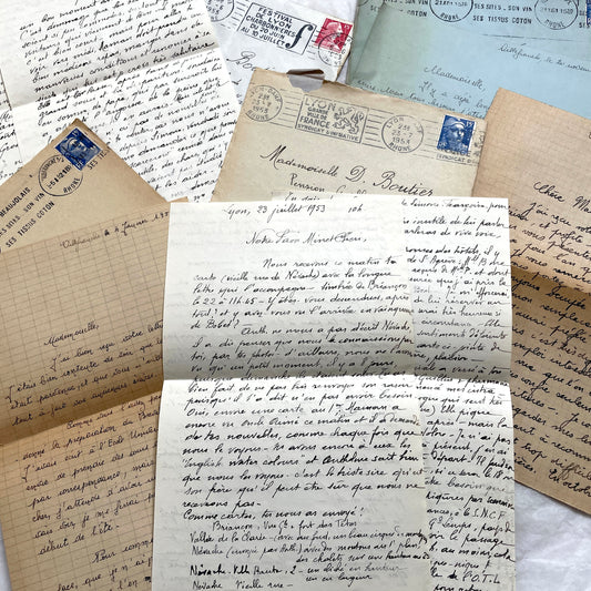 Set of 5 1950s French letters with envelopes, featuring handwritten script and vintage postage stamps from France.