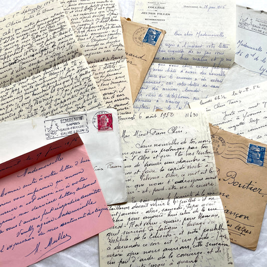 1950s vintage French letters and envelopes set, featuring beautiful handwritten script, postage stamps, and postmarks.