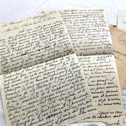 1950s vintage French letters and envelopes set, featuring beautiful handwritten script, postage stamps, and postmarks.