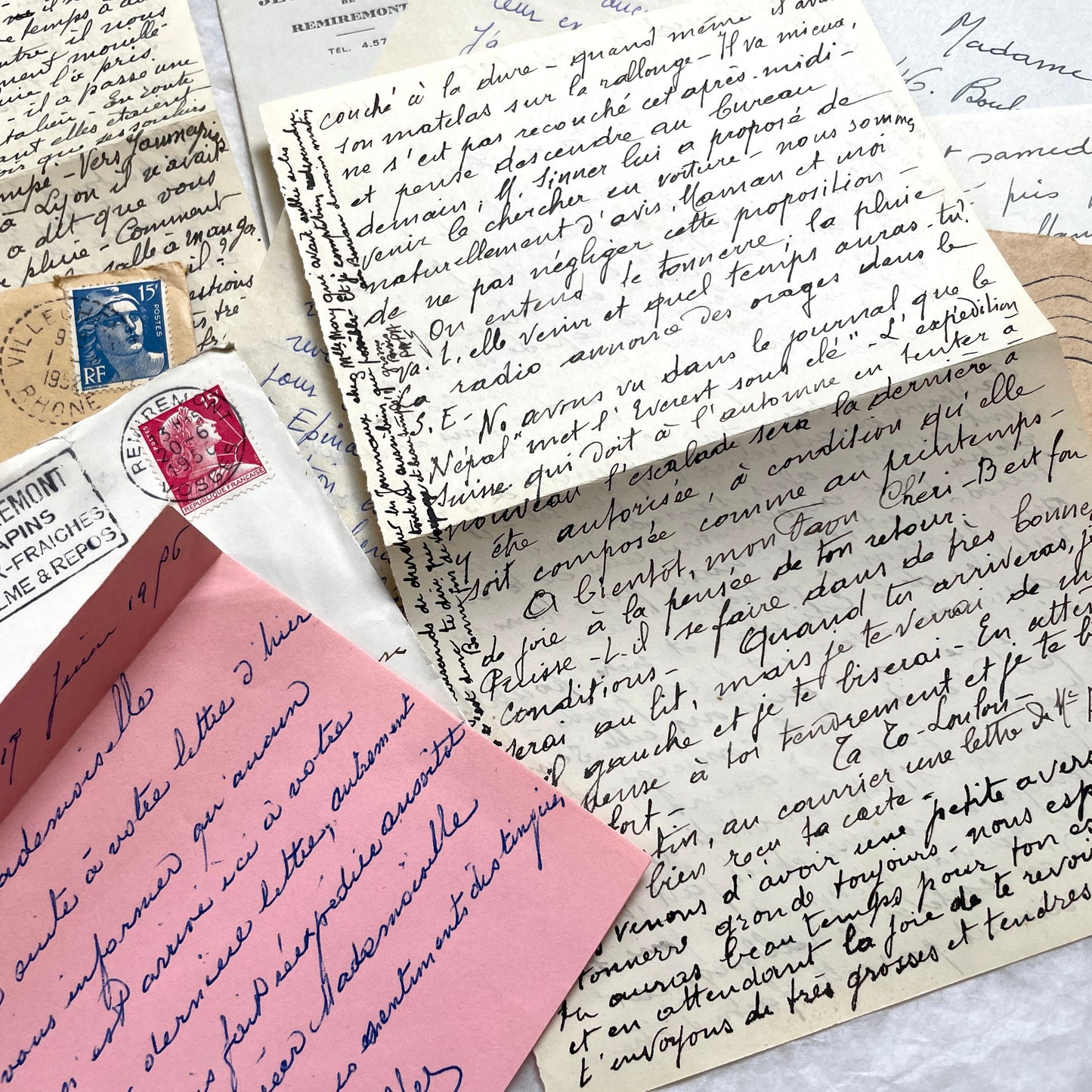 1950s vintage French letters and envelopes set, featuring beautiful handwritten script, postage stamps, and postmarks.
