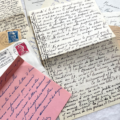 1950s vintage French letters and envelopes set, featuring beautiful handwritten script, postage stamps, and postmarks.