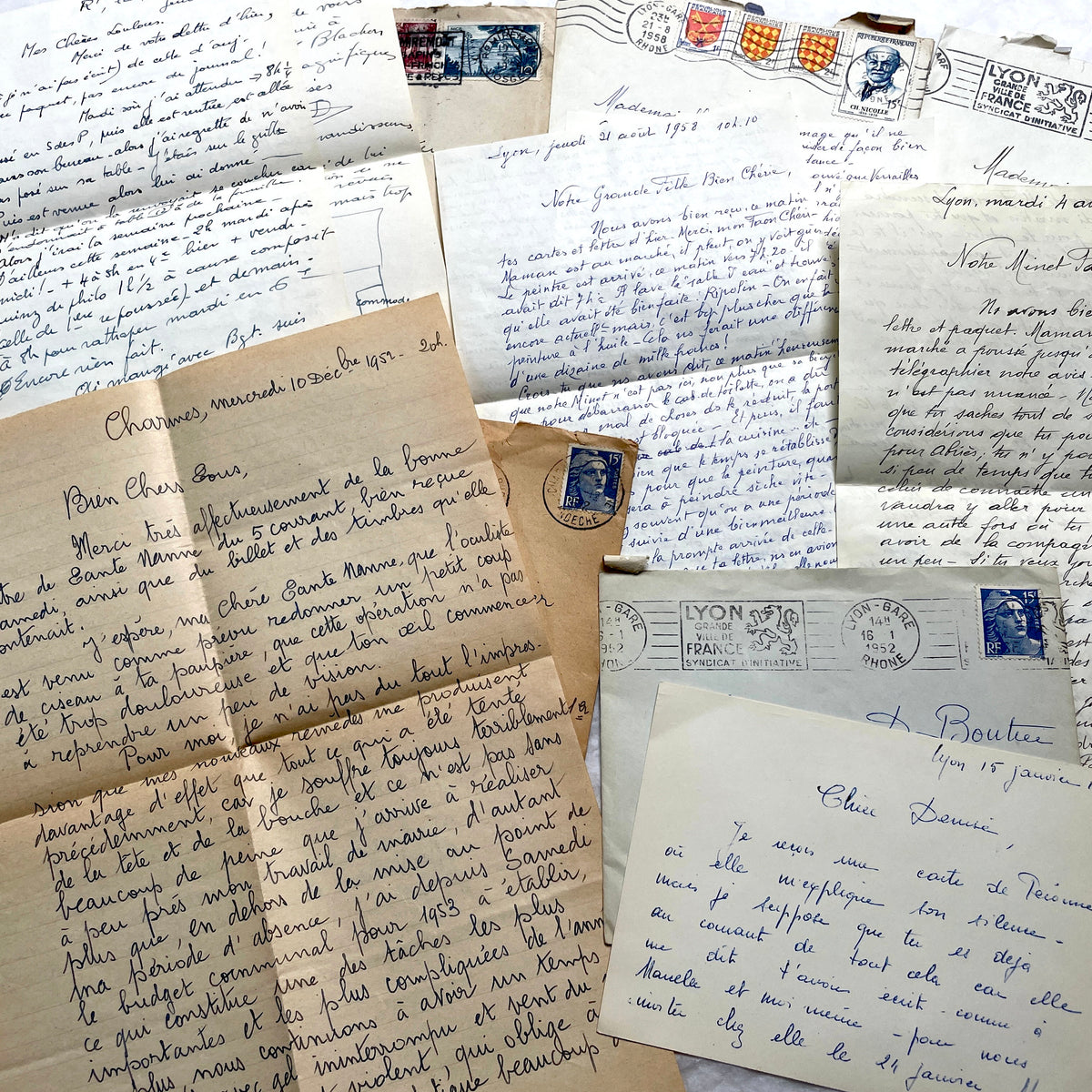 1950s French handwritten letters set with envelopes, vintage stamps, and postmarks. Historical correspondence.