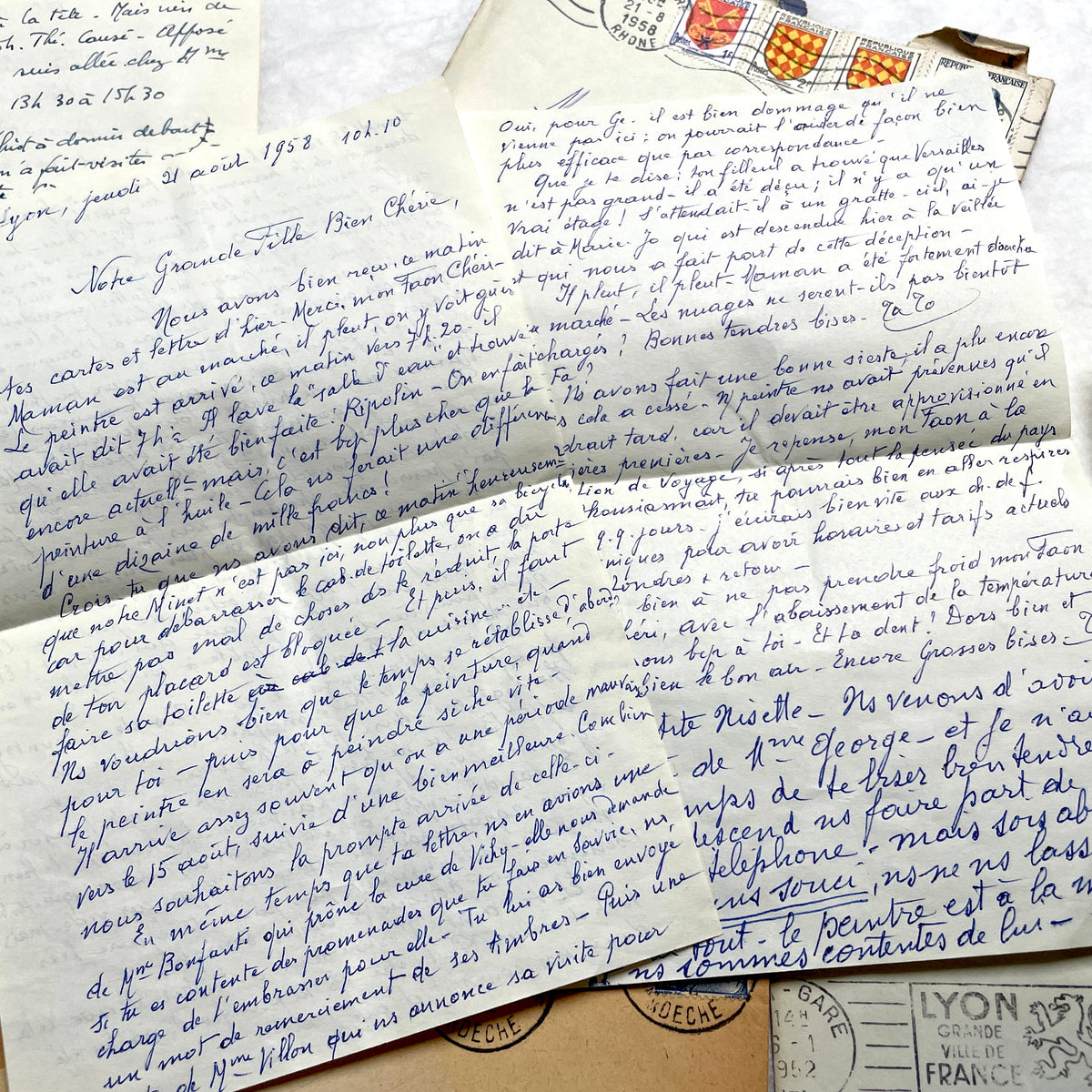 1950s French handwritten letters set with envelopes, vintage stamps, and postmarks. Historical correspondence.