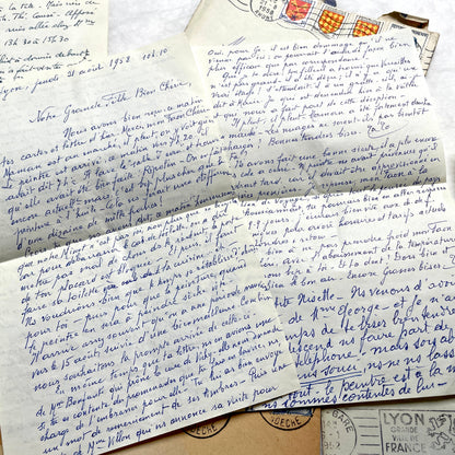 1950s French handwritten letters set with envelopes, vintage stamps, and postmarks. Historical correspondence.