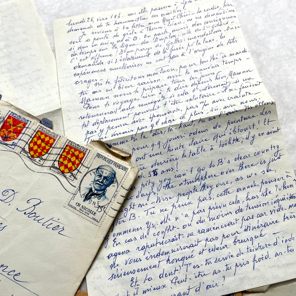 1950s French handwritten letters set with envelopes, vintage stamps, and postmarks. Historical correspondence.