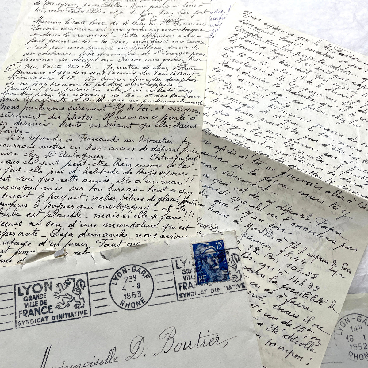 1950s French handwritten letters set with envelopes, vintage stamps, and postmarks. Historical correspondence.