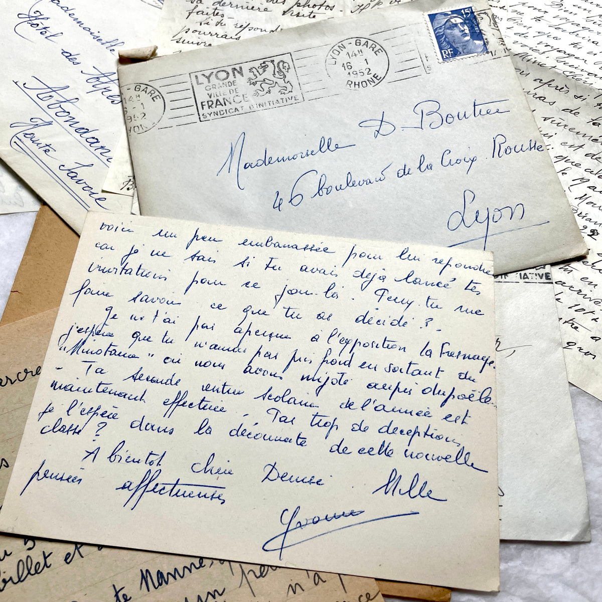 1950s French handwritten letters set with envelopes, vintage stamps, and postmarks. Historical correspondence.
