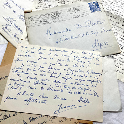 1950s French handwritten letters set with envelopes, vintage stamps, and postmarks. Historical correspondence.