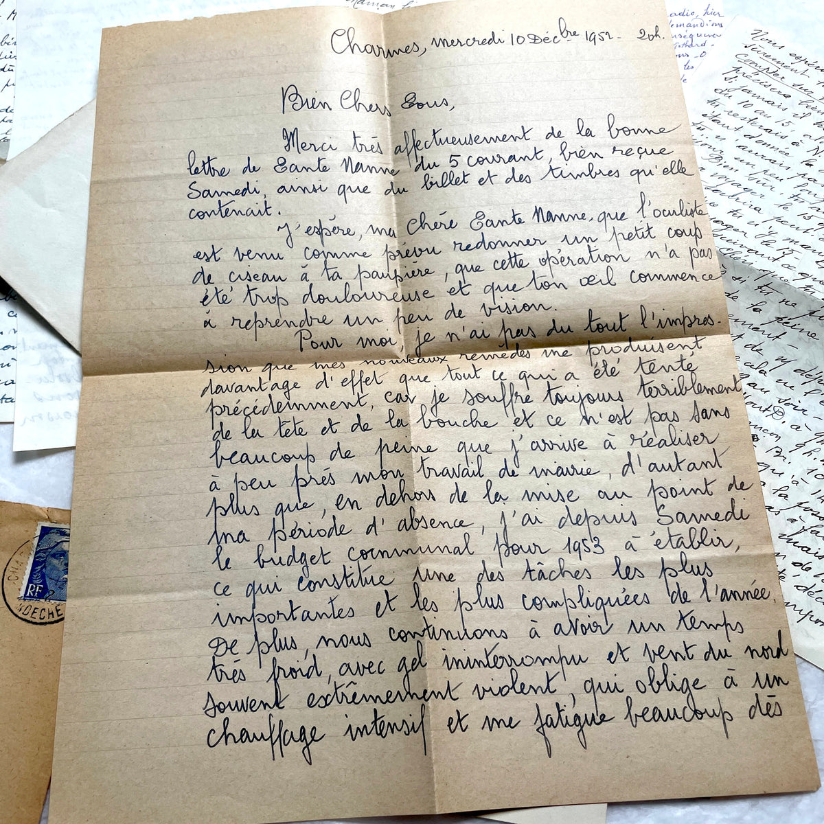 1950s French handwritten letters set with envelopes, vintage stamps, and postmarks. Historical correspondence.