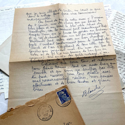 1950s French handwritten letters set with envelopes, vintage stamps, and postmarks. Historical correspondence.