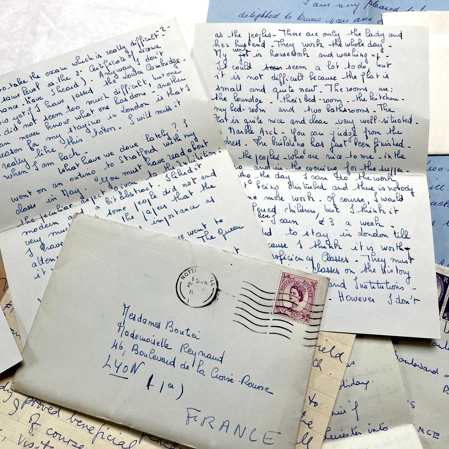 Set of 1960s handwritten letters and envelopes with vintage stamps and postmarks, displaying English and French text.