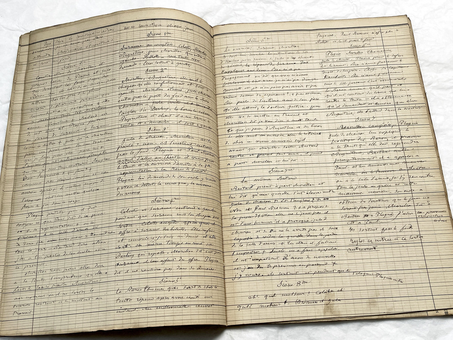 Late 19th French play script manuscript showing neat handwritten text in a vintage ledger book.