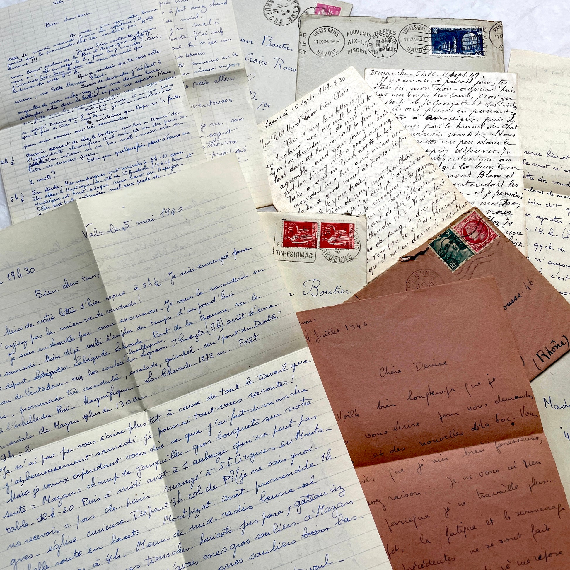 Set of 1940s vintage French letters with envelopes, featuring handwritten text, original stamps, and postmarks.