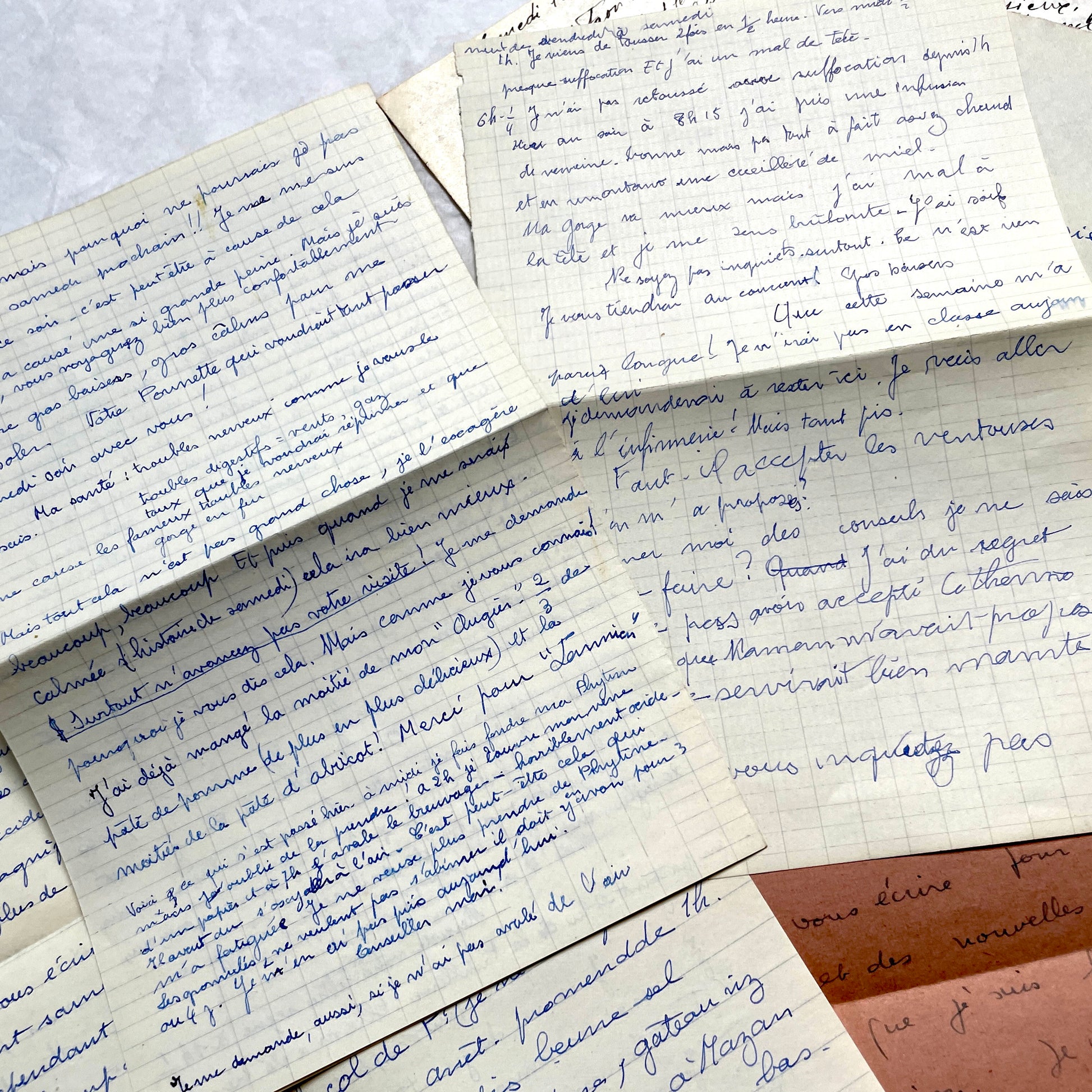 Set of 1940s vintage French letters with envelopes, featuring handwritten text, original stamps, and postmarks.