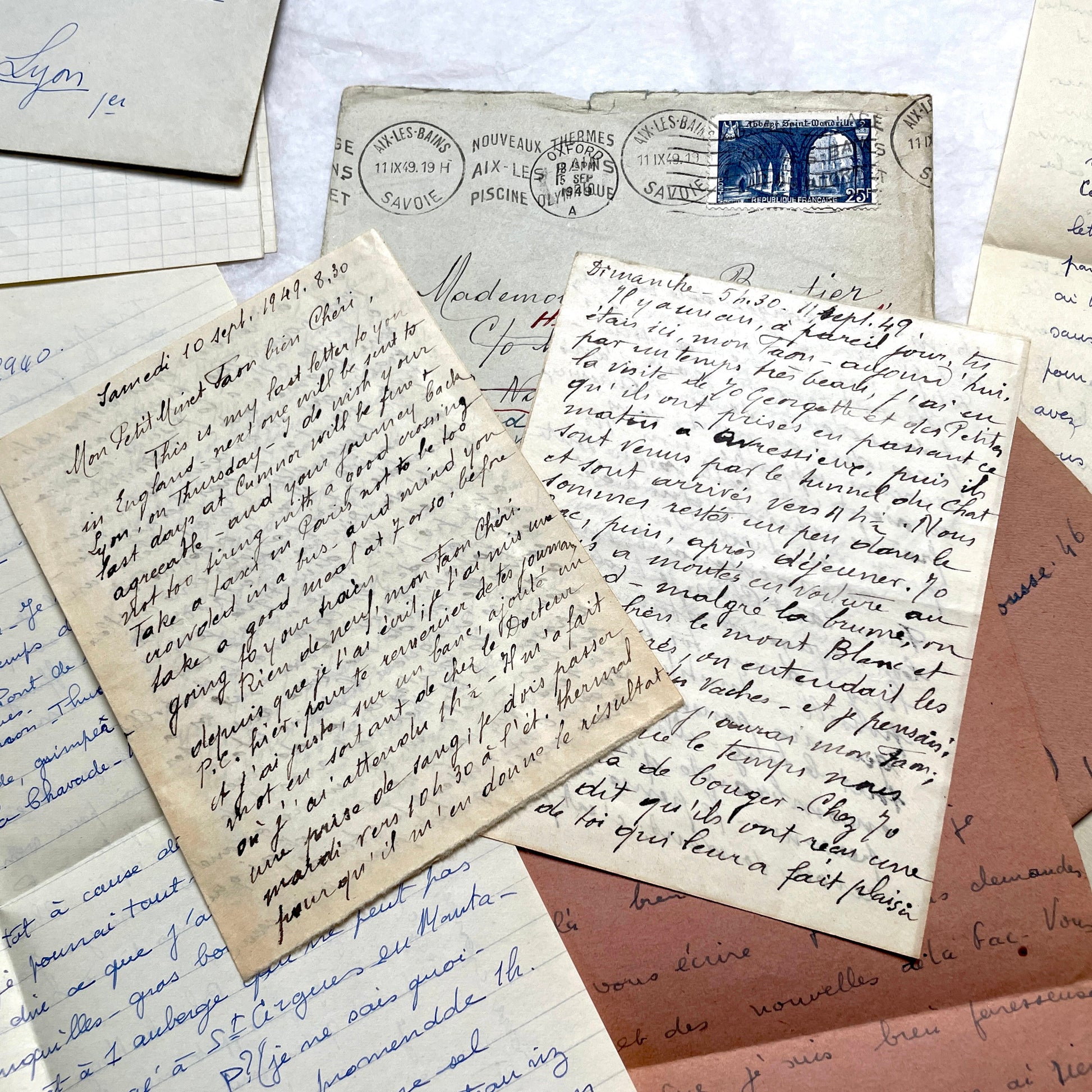 Set of 1940s vintage French letters with envelopes, featuring handwritten text, original stamps, and postmarks.