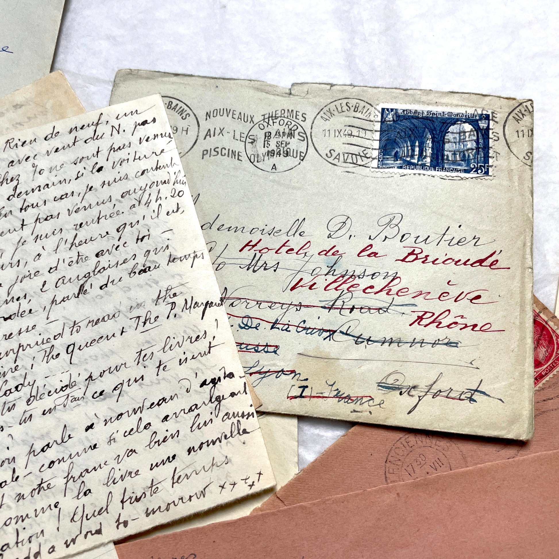 Set of 1940s vintage French letters with envelopes, featuring handwritten text, original stamps, and postmarks.