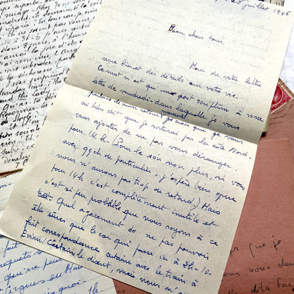 Set of 1940s vintage French letters with envelopes, featuring handwritten text, original stamps, and postmarks.