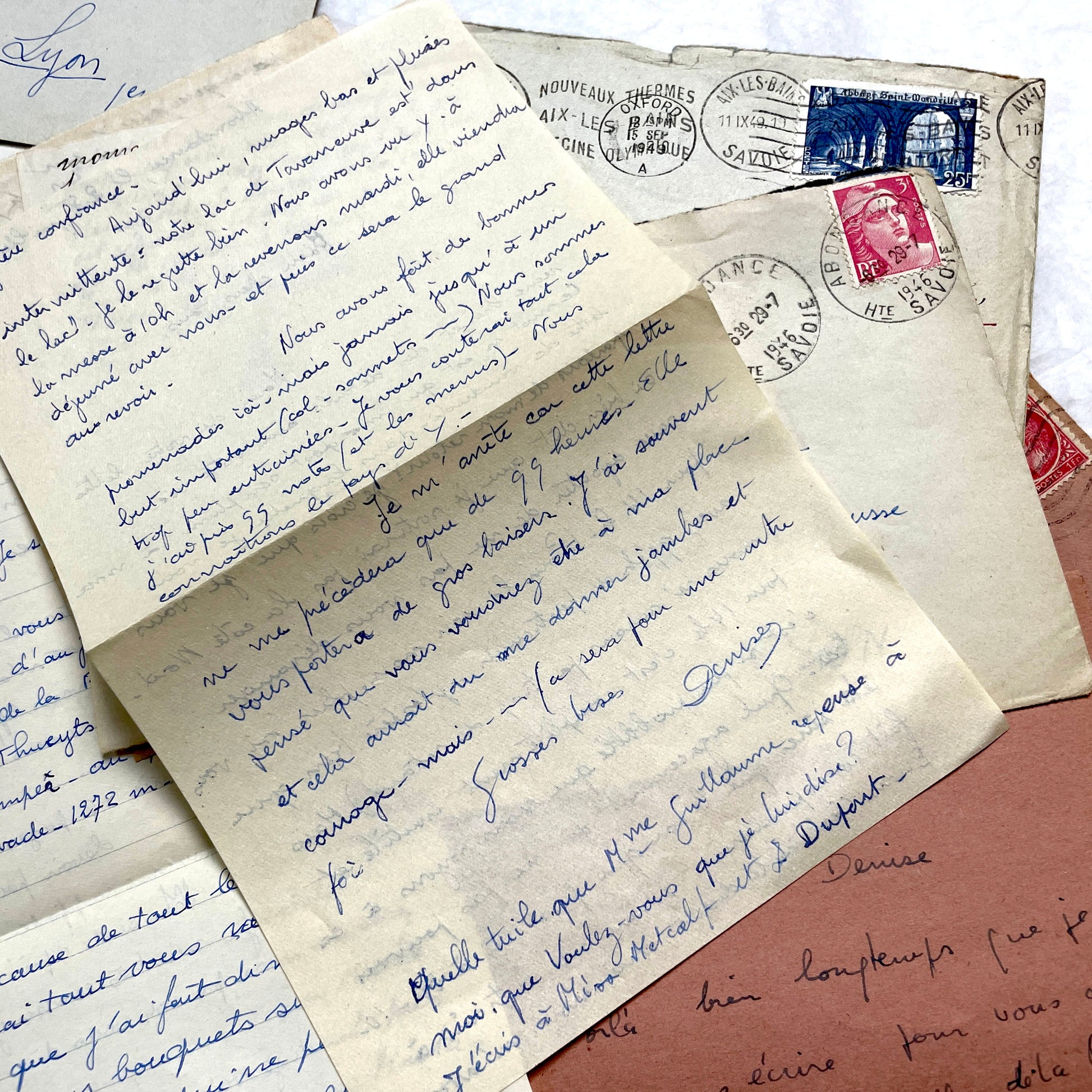 Set of 1940s vintage French letters with envelopes, featuring handwritten text, original stamps, and postmarks.