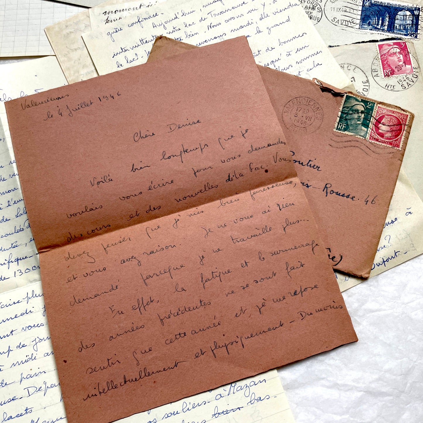 Set of 1940s vintage French letters with envelopes, featuring handwritten text, original stamps, and postmarks.