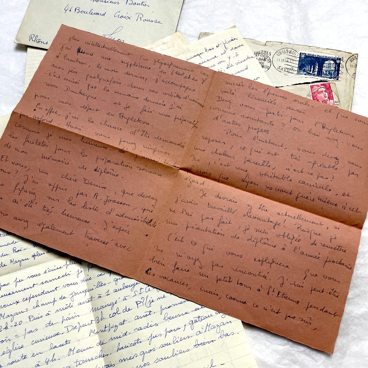Set of 1940s vintage French letters with envelopes, featuring handwritten text, original stamps, and postmarks.