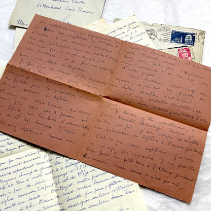 Set of 1940s vintage French letters with envelopes, featuring handwritten text, original stamps, and postmarks.