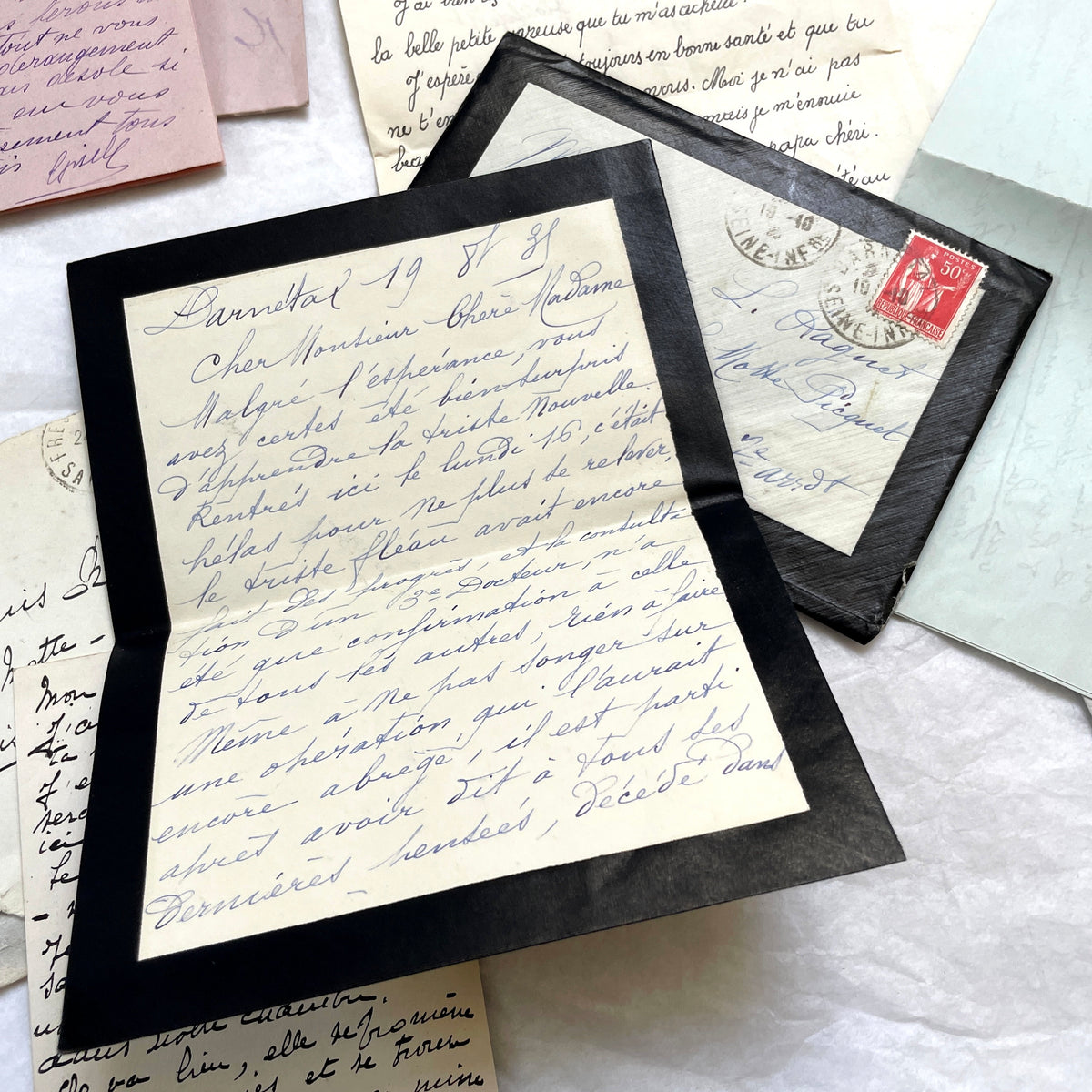 Set of 5 1930s French handwritten letters with original envelopes, displaying elegant script and vintage stamps.
