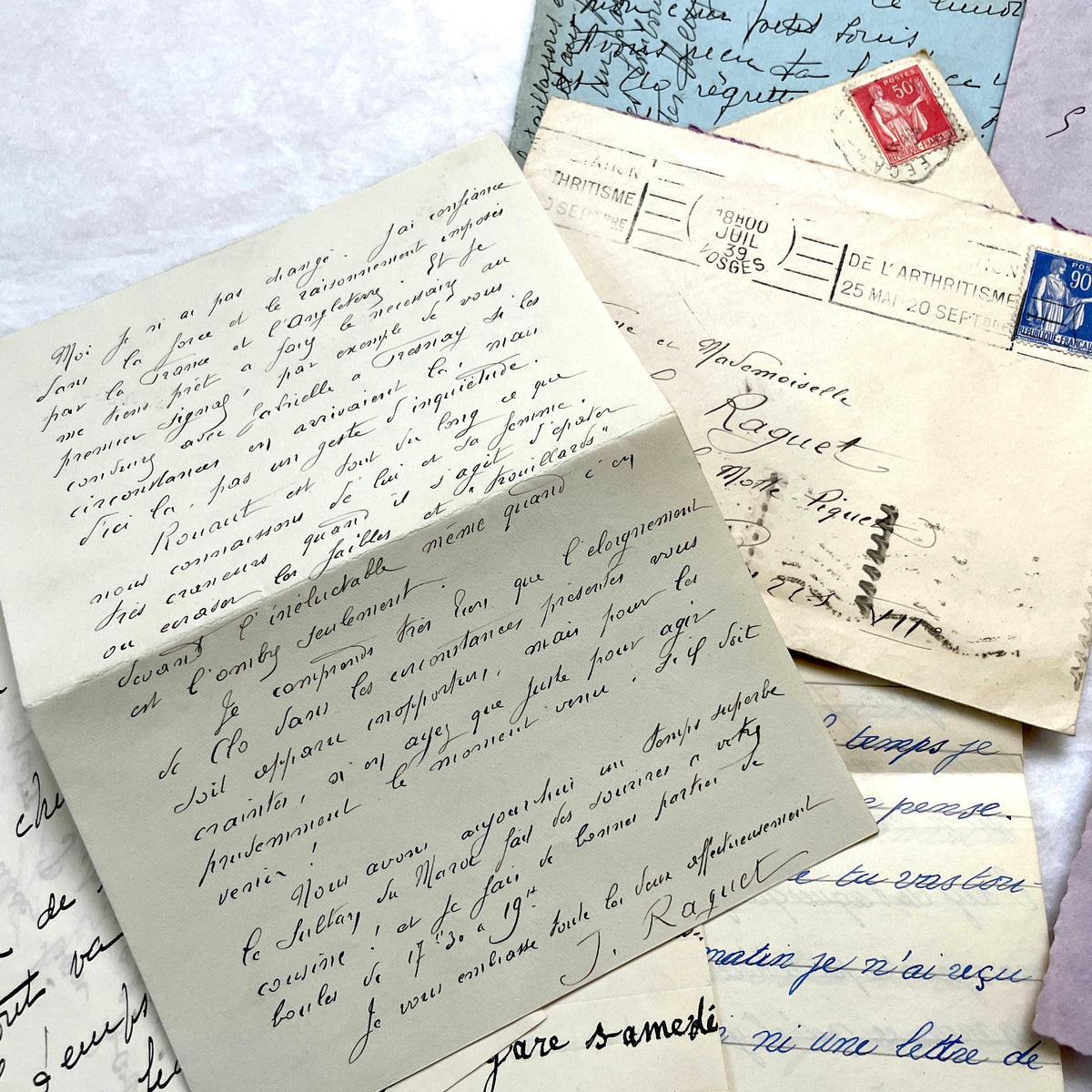1930s French handwritten letters and envelopes set, featuring vintage stamps and elegant cursive script.