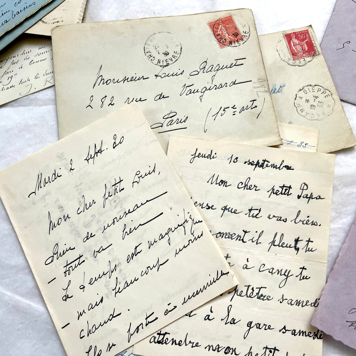 1930s French handwritten letters and envelopes set, featuring vintage stamps and elegant cursive script.