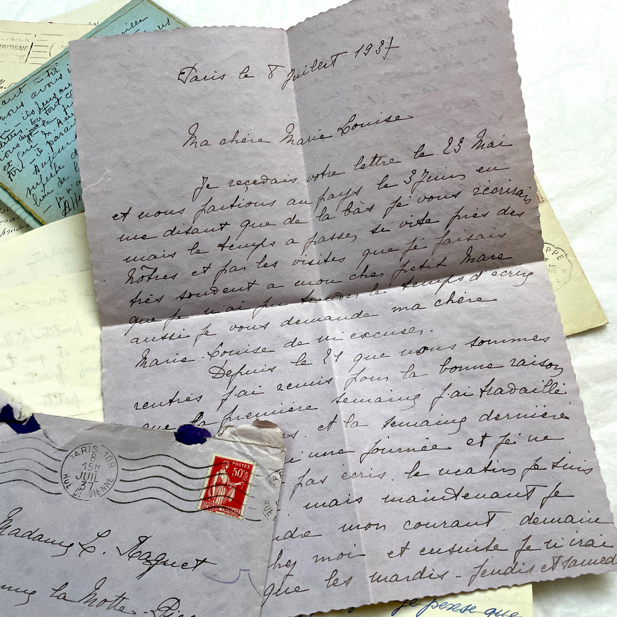 1930s French handwritten letters and envelopes set, featuring vintage stamps and elegant cursive script.