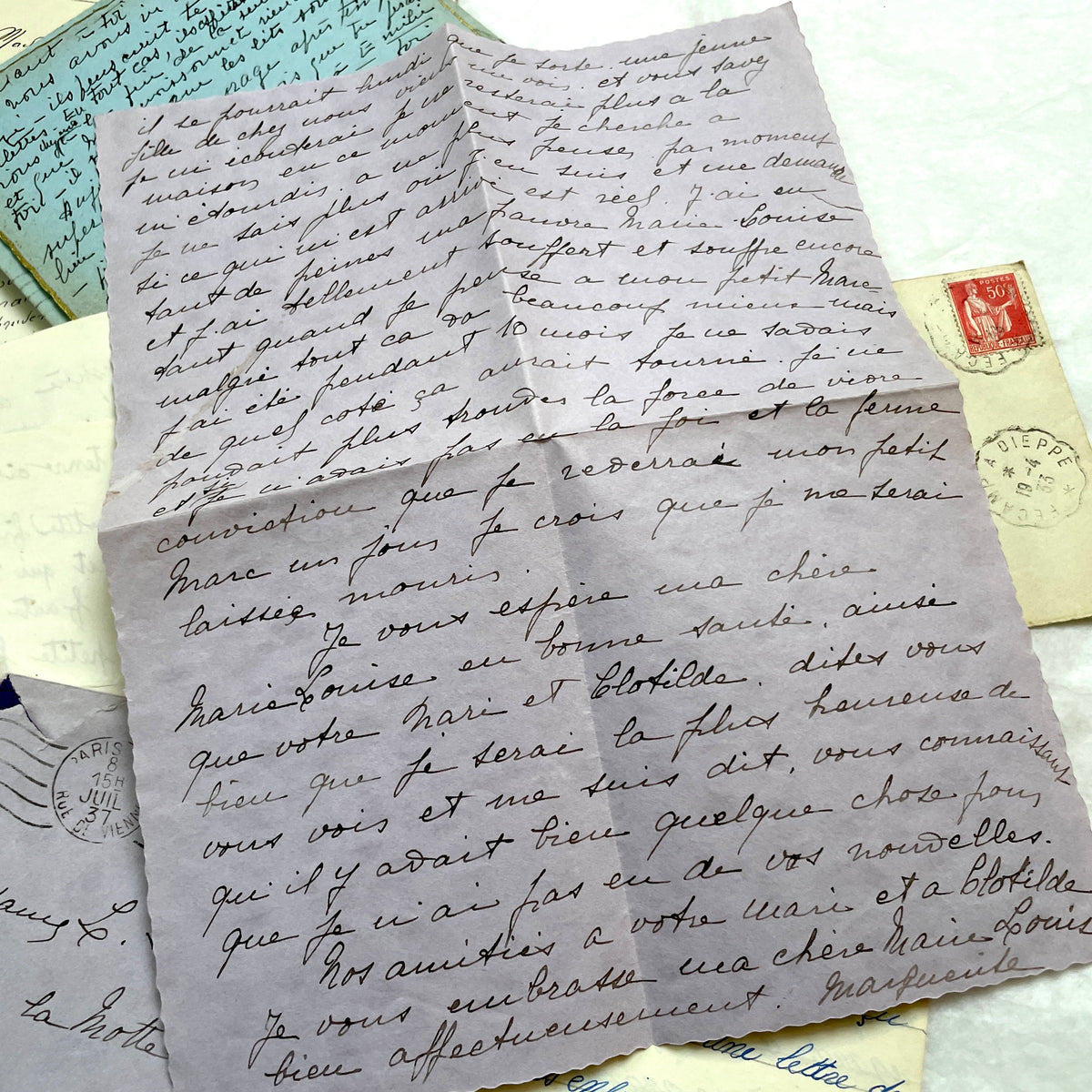 1930s French handwritten letters and envelopes set, featuring vintage stamps and elegant cursive script.