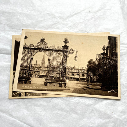 1910s French postcard lot of Nancy landmarks, including Place Stanislas and Palais du Gouvernement, in sepia tone.
