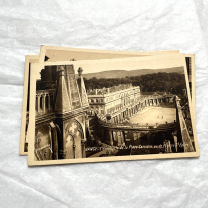 1910s French postcard lot of Nancy landmarks, including Place Stanislas and Palais du Gouvernement, in sepia tone.