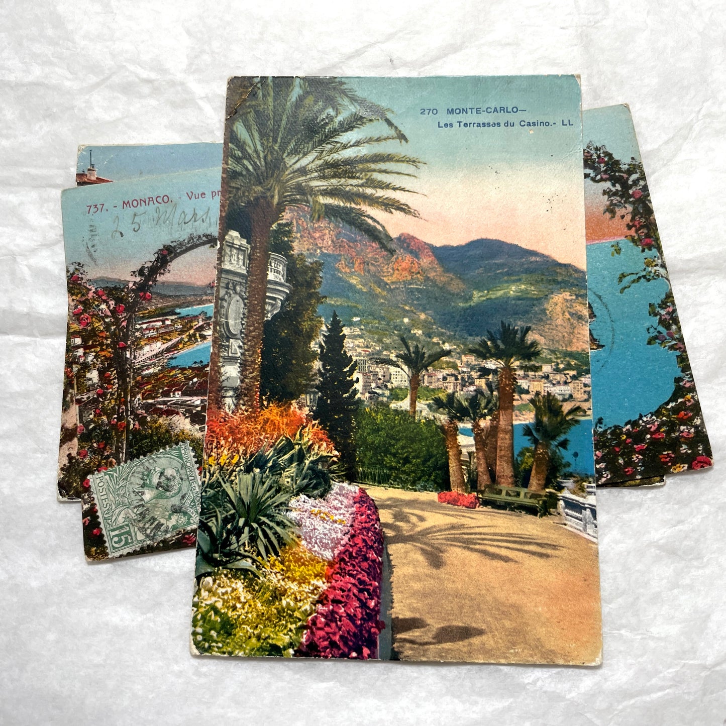 Vintage 1920s French postcard lot of Monaco and Monte-Carlo, featuring scenic coastal views with lush flowers and palm trees.