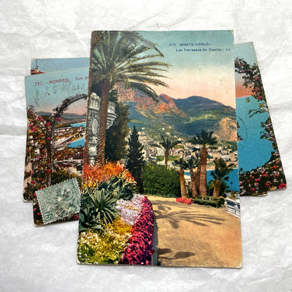 Vintage 1920s French postcard lot of Monaco and Monte-Carlo, featuring scenic coastal views with lush flowers and palm trees.