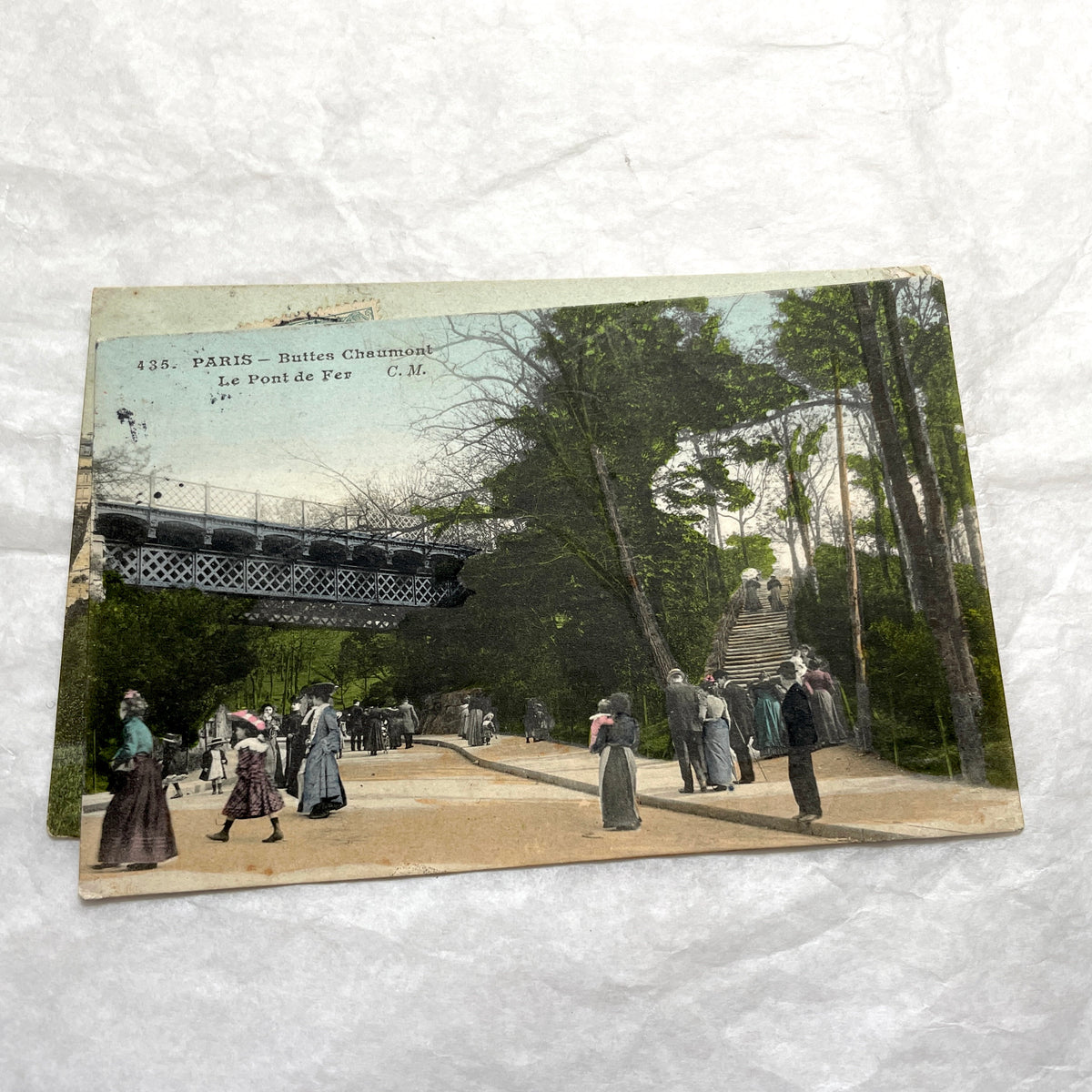 1900s French postcards lot featuring Parisian park scenes from Buttes Chaumont and Parc Montsouris with people.