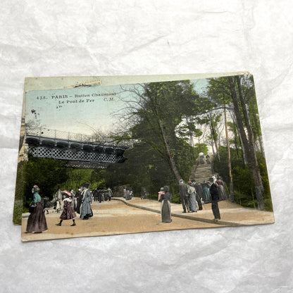 1900s French postcards lot featuring Parisian park scenes from Buttes Chaumont and Parc Montsouris with people.