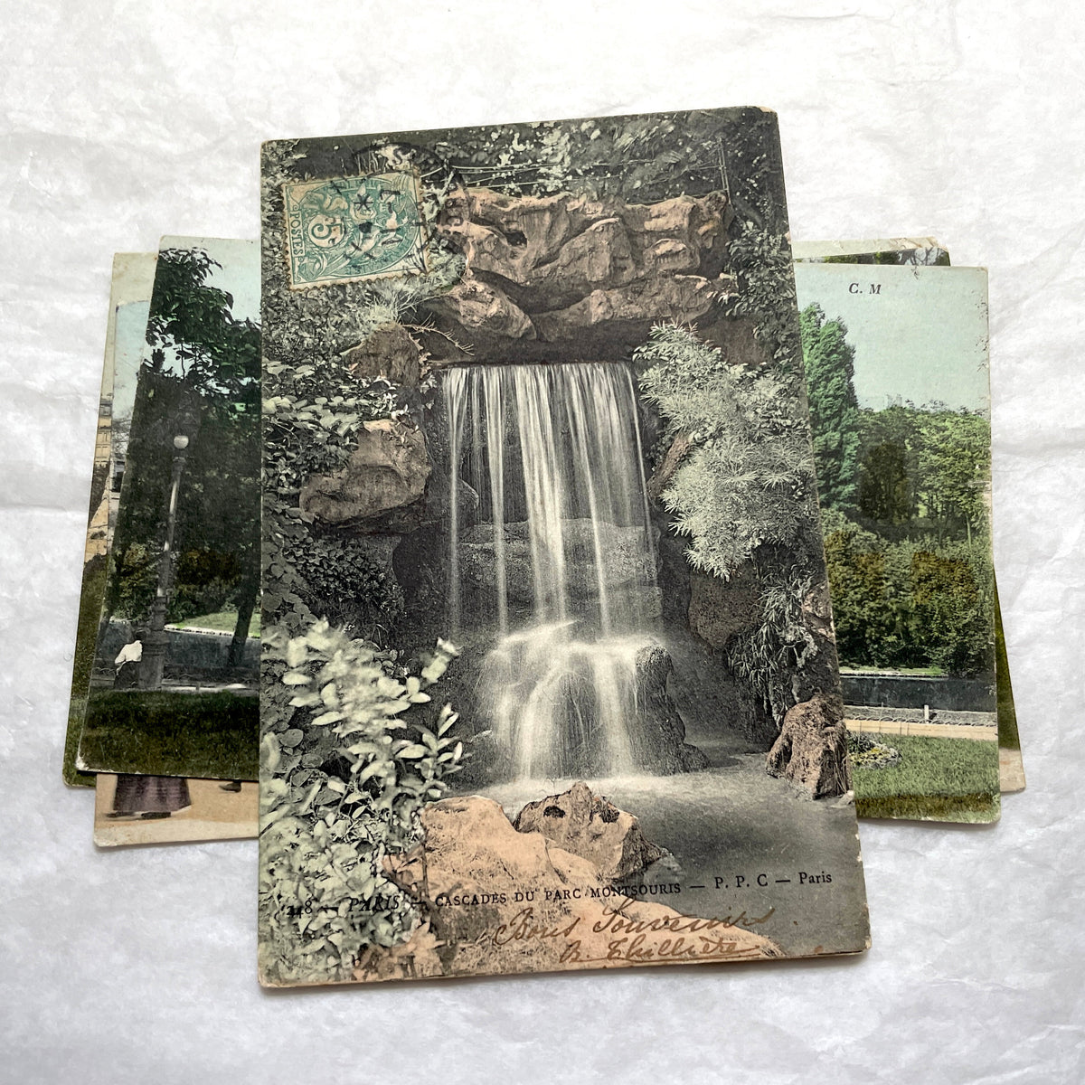 1900s French postcards lot featuring Parisian park scenes from Buttes Chaumont and Parc Montsouris with people.