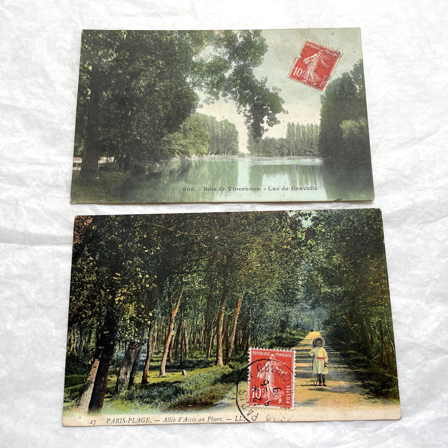 1900s French postcard lot featuring Bois de Vincennes lake and Paris-Plage alley with a person.