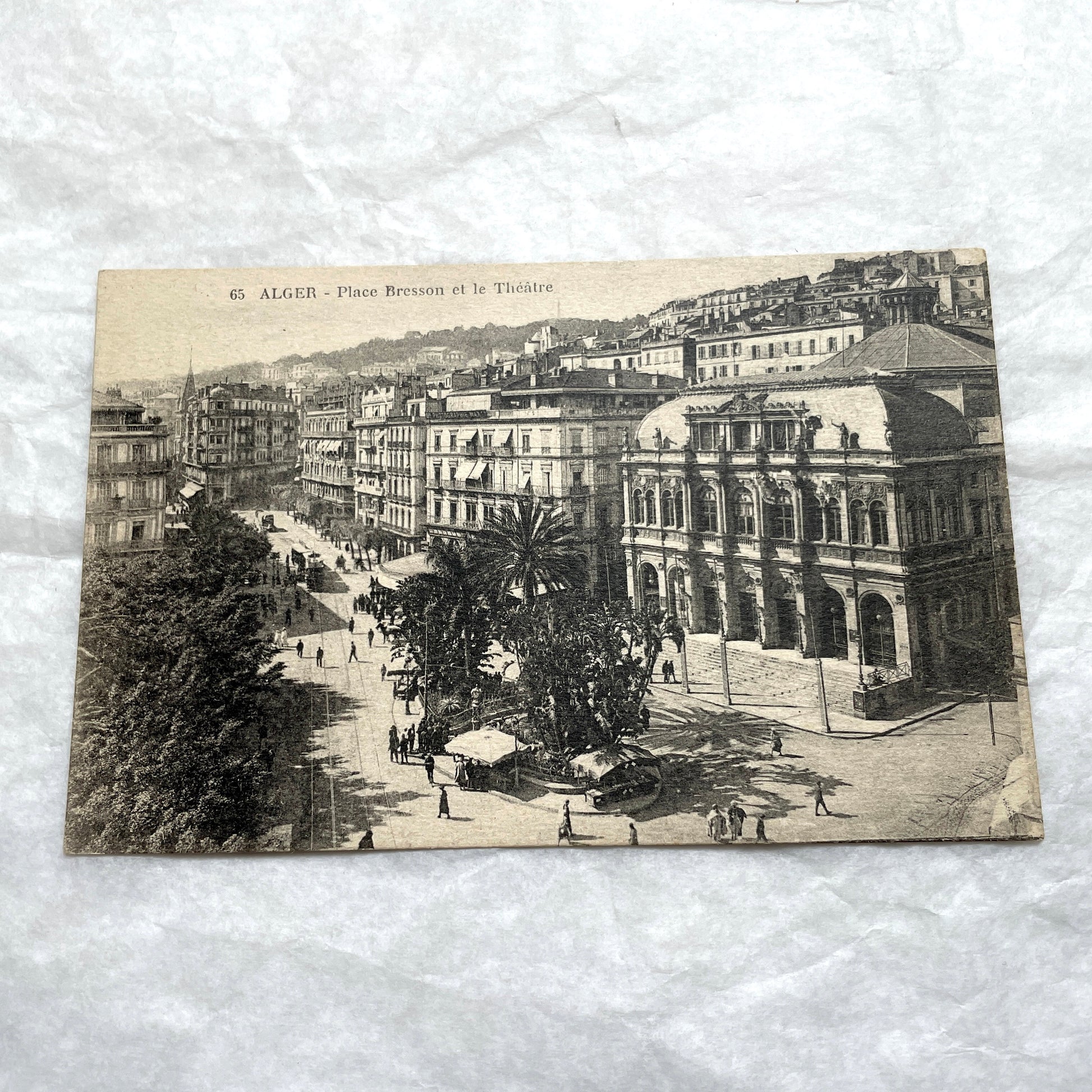 Lot of 1910s Algiers postcards showing French colonial city views, harbor, train station, and theater architecture.